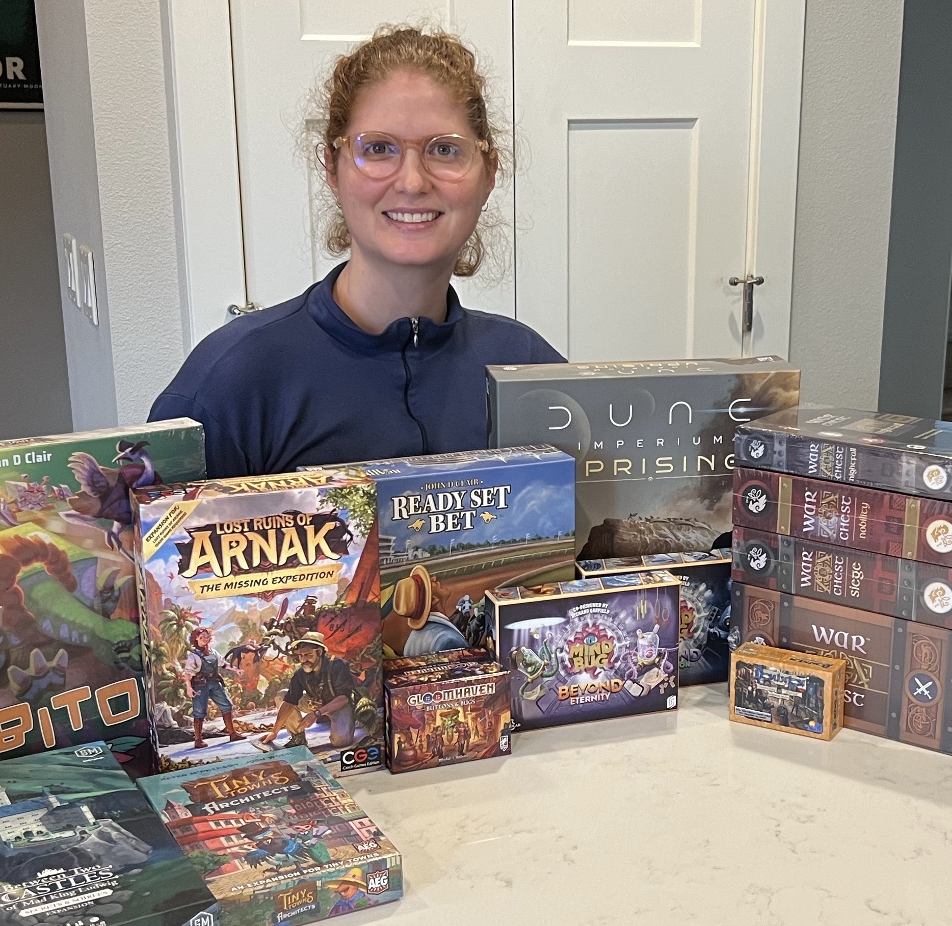 Photo of Jennifer Abele with various board games